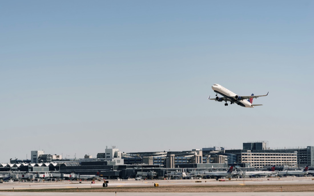 Aircraft taking off above the terminal