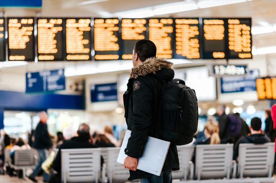 Passenger checking the departures board
